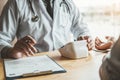 Doctor Measuring arterial blood pressure with man patient on arm Health care in hospital Royalty Free Stock Photo