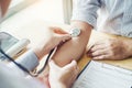 Doctor Measuring arterial blood pressure man patient on arm Health care in hospital Royalty Free Stock Photo