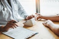 Doctor Measuring arterial blood pressure man patient on right arm Health care hospital and medicine concept Royalty Free Stock Photo