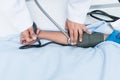 Doctor measuring blood pressure of child patient. With care Royalty Free Stock Photo