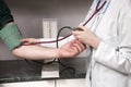 Doctor measuring blood pressure