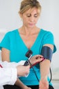 Doctor measuring blood pressure patient Royalty Free Stock Photo