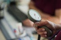 Doctor measuring blood pressure of a patient