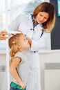 Doctor measuring height of a girl