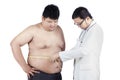 Doctor measuring a patient obesity 1 Royalty Free Stock Photo