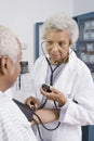 Doctor Measuring Patient's Blood Pressure