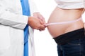 Doctor measuring stomach at pregnant woman