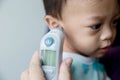 Doctor measuring temperature cute baby boy at hospital . Royalty Free Stock Photo