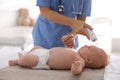 Doctor measuring temperature of little baby with non-contact thermometer in clinic. Health care Royalty Free Stock Photo