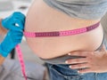 Doctor measuring the volume of a pregnant woman& x27;s abdomen using a centimeter tape. Royalty Free Stock Photo