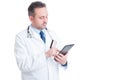 Doctor or medic using credit card and wireless tablet