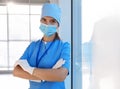 Doctor in medical gloves, protective mask and scrubs indoors. Space for text Royalty Free Stock Photo