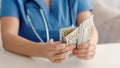 Doctor money healthcare cost 100 us dollar cash Royalty Free Stock Photo