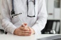 Doctor neurologist with hammer in hands in clinic