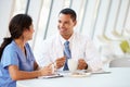 Doctor And Nurse Chatting In Modern Hospital Canteen Royalty Free Stock Photo
