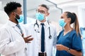 Doctor, nurse and covid with a team of healthcare or medical workers working together in collaboration in a hospital Royalty Free Stock Photo