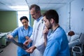 Doctor and nurse discussing x-ray in ward Royalty Free Stock Photo