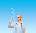 Doctor or nurse drawing checkmark into checkbox Royalty Free Stock Photo