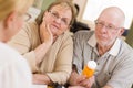 Doctor or Nurse Explaining Prescription Medicine to Senior Couple Royalty Free Stock Photo