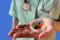 Doctor or nurse give pills. Pharmacist with tablets in hand. women giving medicament in clinic, drug store or pharmacy.