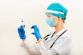 Doctor or nurse holding hands flu vaccine on beige background, measles injection syringe for baby, man, woman vaccination,