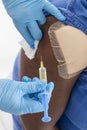 Doctor or Nurse holding a syringe give an injection, on white background