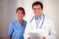 Doctor and nurse looking and smiling at you Royalty Free Stock Photo