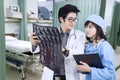 Doctor and nurse looking at xray in hospital