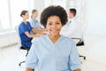 Doctor or nurse over group of medics at hospital Royalty Free Stock Photo