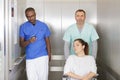doctor nurse and patient in elevator in hospital Royalty Free Stock Photo