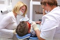 Doctor and nurse perform the procedure for dental treatment