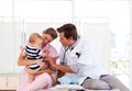 Doctor and nurse playing with a baby Royalty Free Stock Photo