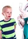 Doctor or nurse preparing injection of little boy. Royalty Free Stock Photo