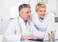 Doctor and nurse reading information Royalty Free Stock Photo