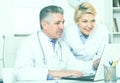 Doctor and nurse reading information Royalty Free Stock Photo