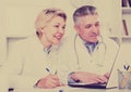 Doctor and nurse reading information Royalty Free Stock Photo