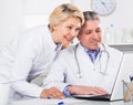 Doctor and nurse reading information Royalty Free Stock Photo