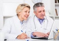 Doctor and nurse reading information Royalty Free Stock Photo