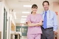 Doctor And Nurse Standing In A Hospital Corridor Royalty Free Stock Photo