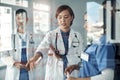 Doctor, nurse and team work on glass board for medical solution, brainstorming or problem solving of patient injury Royalty Free Stock Photo