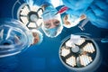 Doctor and nurse wearing protective suit and medical masks holding sterile tools Royalty Free Stock Photo