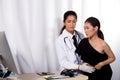 Doctor Nurse in white blue shirt with stethoscope and rubber gloves