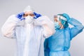 Doctor and nurse during work shift in medical protective equipment. The concept of combating pandemic and covid 19 Royalty Free Stock Photo