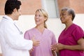 Doctor And Nurses Standing Outside A Hospital Royalty Free Stock Photo