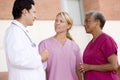 Doctor And Nurses Standing Outside A Hospital Royalty Free Stock Photo