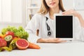 Doctor nutritionist and holding digital tablet