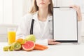 Doctor nutritionist holding blank clipboard Royalty Free Stock Photo