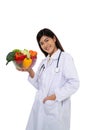 Doctor or nutritionist holding fresh fruit Orange, red and green apples and smile in clinic. Healthy diet Concept of nutrition Royalty Free Stock Photo