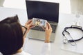 Doctor online medical consultation video call. Female pediatrician therapist listens to patient a woman and her daughter