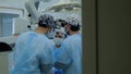 The doctor operates using a microscope during nerve surgery. The surgeon looks through a microscope in a modern Royalty Free Stock Photo